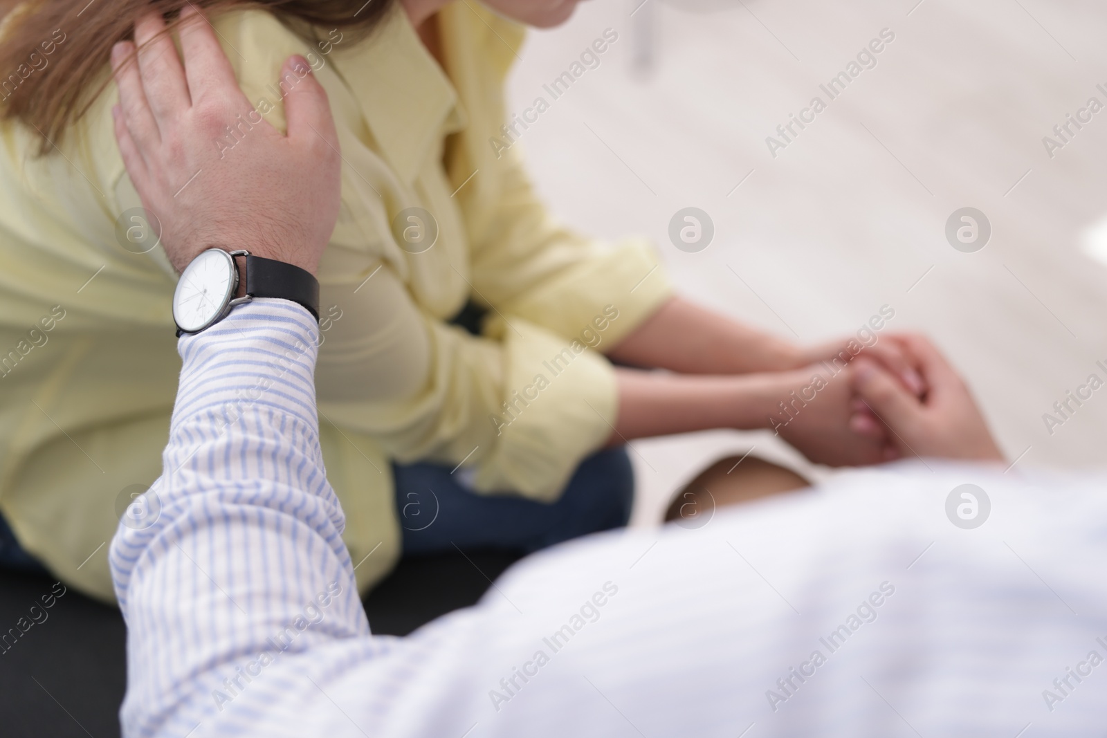 Psychologist supporting patient during therapy session in office, closeup Photo of Psychologist supporting patient during therapy session in office, closeup