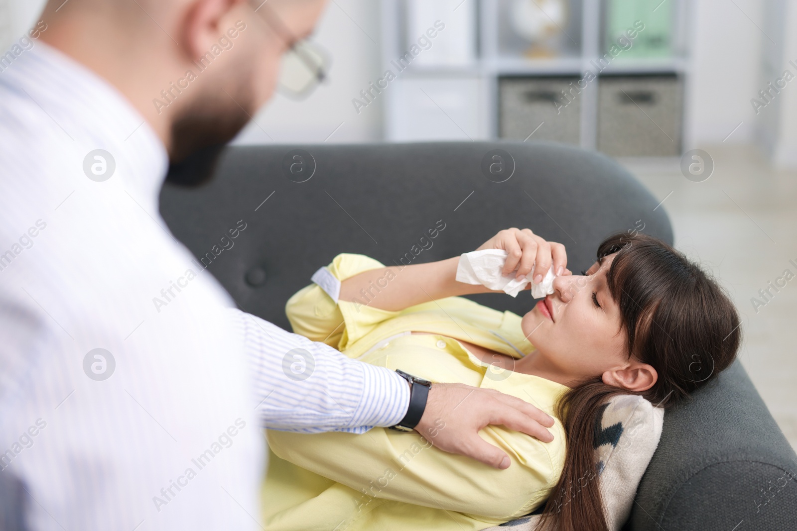 Photo of Psychologist supporting patient during therapy session in office, selective focus