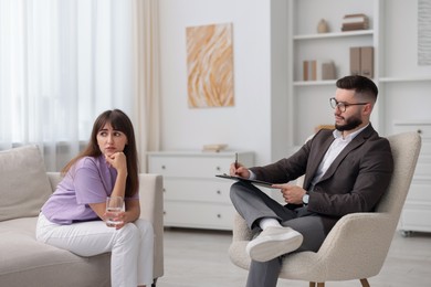 Photo of Professional psychologist working with patient in office