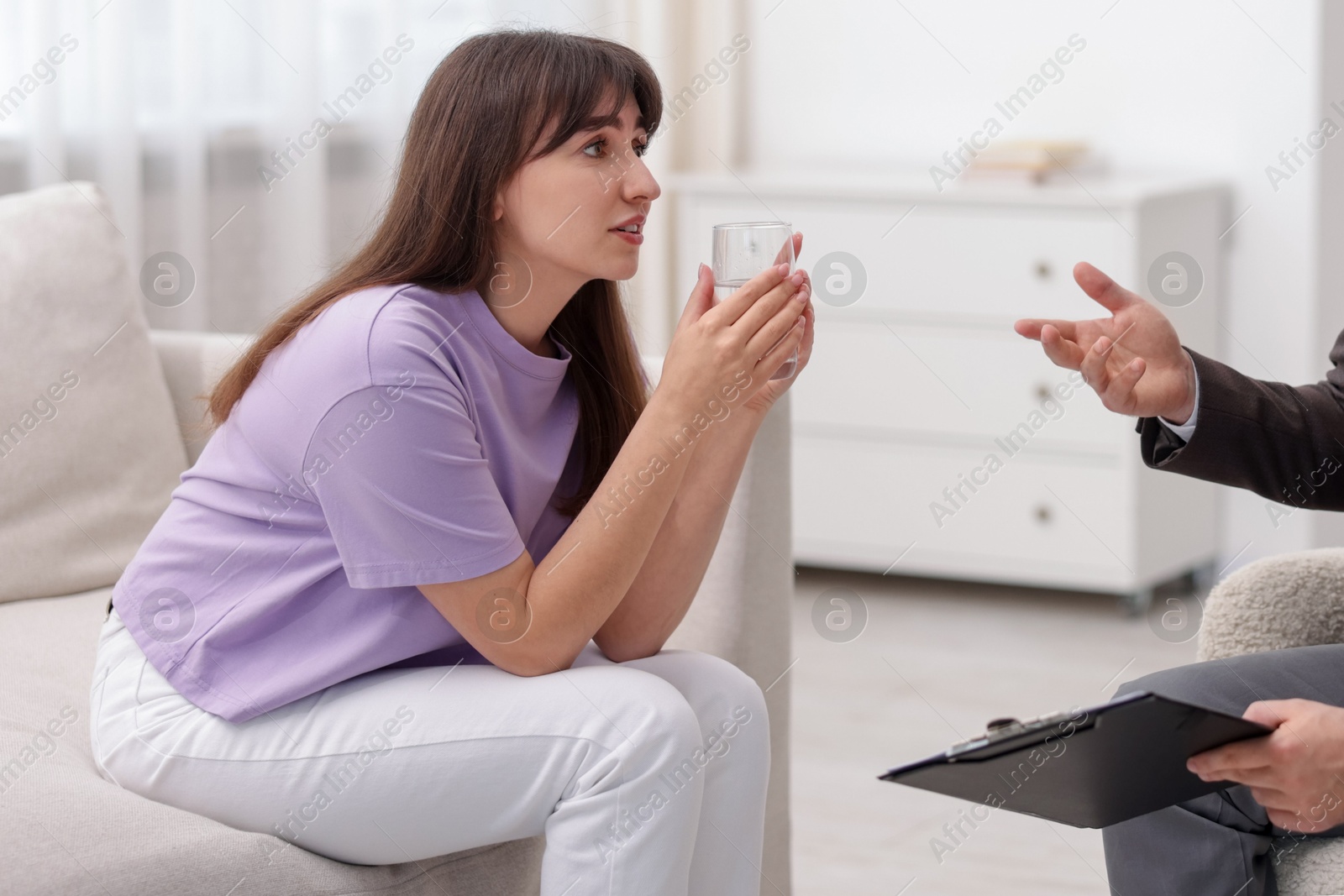 Photo of Professional psychologist working with patient in office, closeup
