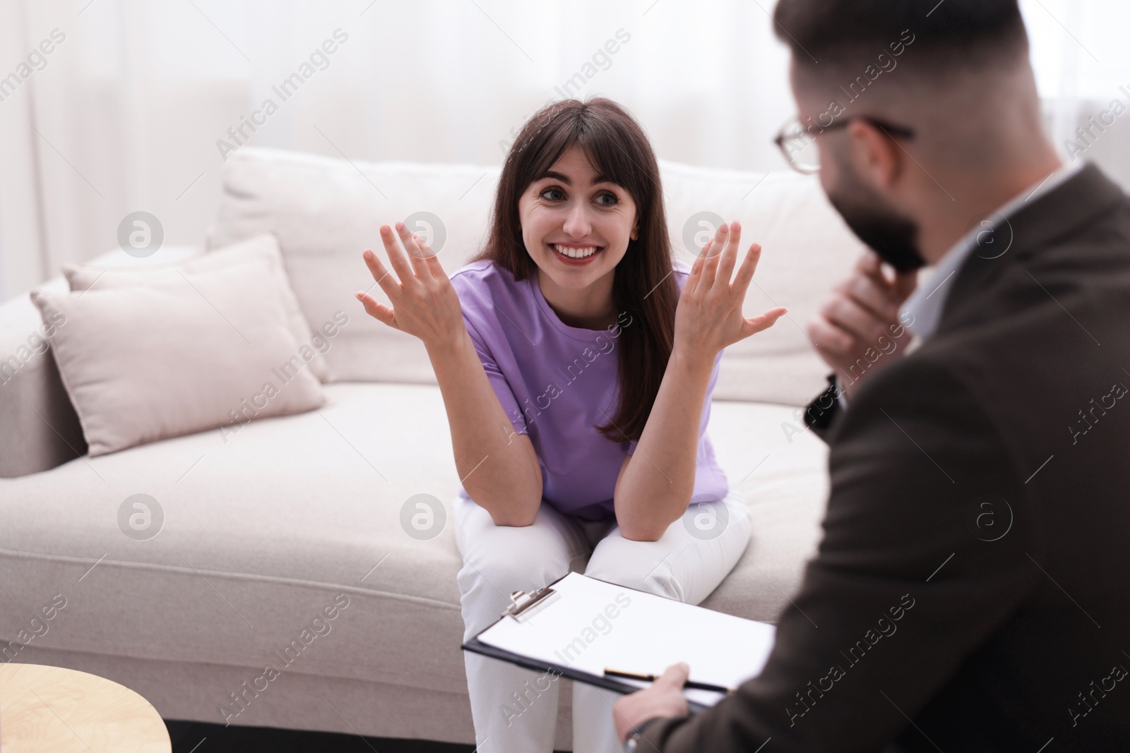 Photo of Professional psychologist working with patient in office, selective focus
