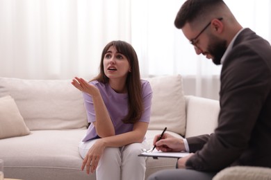 Photo of Professional psychologist working with patient in office