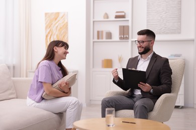 Photo of Professional psychologist working with patient in office