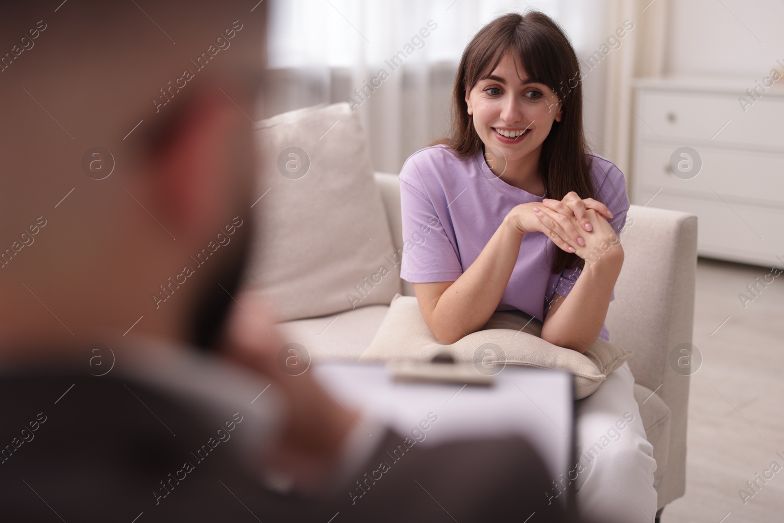 Photo of Professional psychologist working with patient in office, selective focus