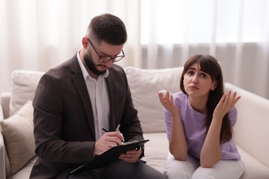 Photo of Professional psychologist working with patient in office