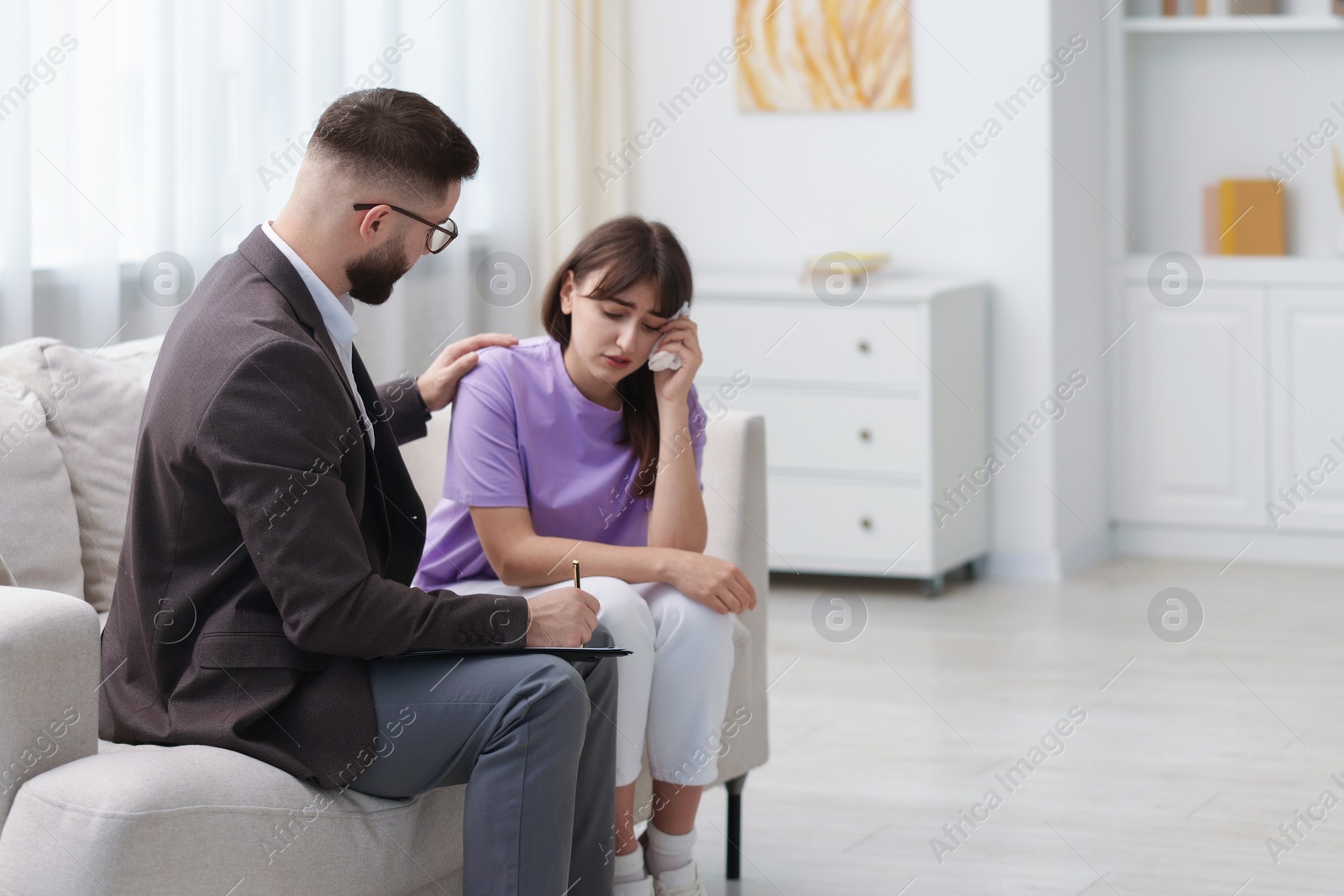 Photo of Professional psychologist working with patient in office, space for text
