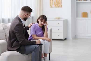 Photo of Professional psychologist working with patient in office, space for text