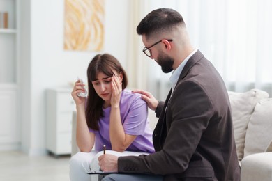 Photo of Professional psychologist working with patient in office
