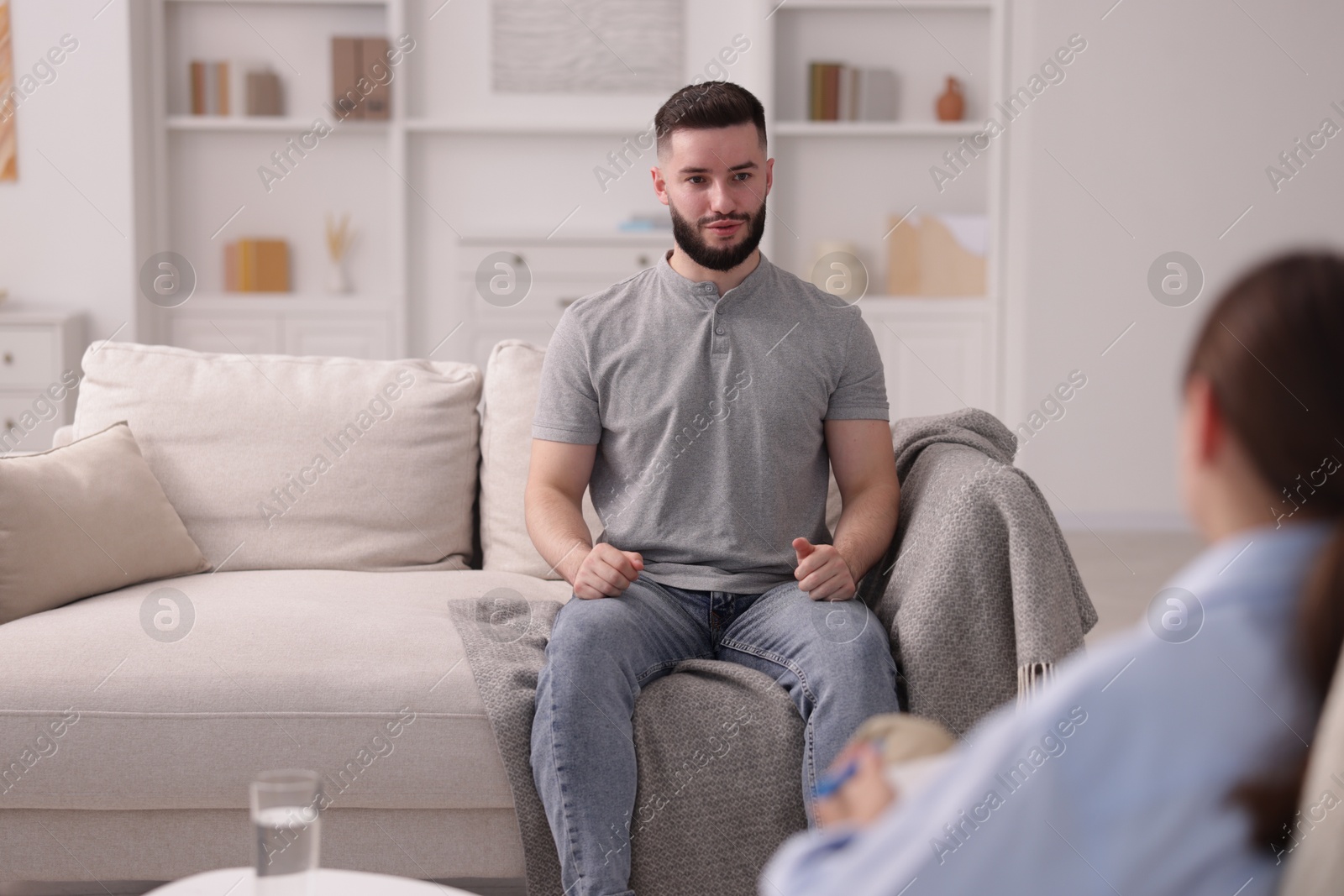 Photo of Professional psychologist working with patient in office, selective focus
