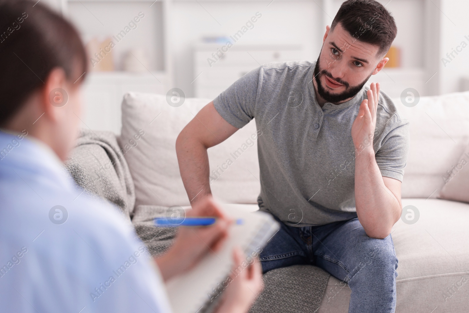 Photo of Professional psychologist working with patient in office, closeup