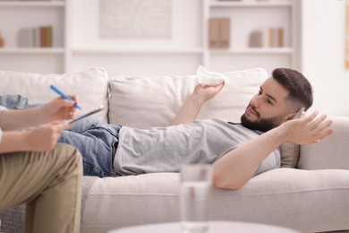 Photo of Professional psychologist working with patient in office, closeup
