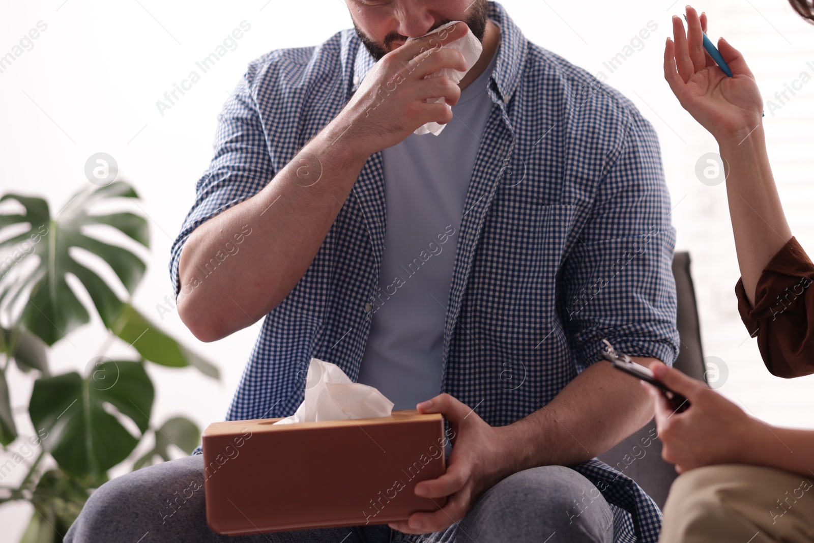 Photo of Professional psychologist working with patient in office, closeup