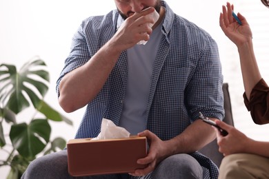 Photo of Professional psychologist working with patient in office, closeup