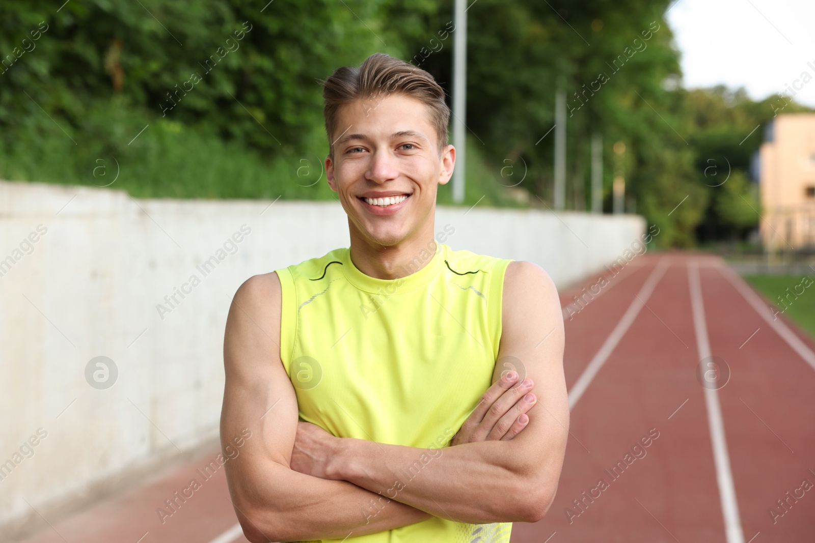Photo of Portrait of sporty man at stadium. Healthy lifestyle