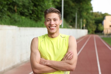 Photo of Portrait of sporty man at stadium. Healthy lifestyle