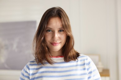 Photo of Portrait of beautiful teenage girl at home