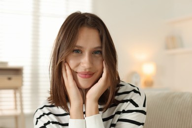 Photo of Portrait of beautiful teenage girl at home