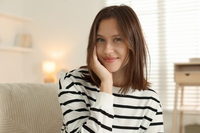 Photo of Portrait of beautiful teenage girl at home