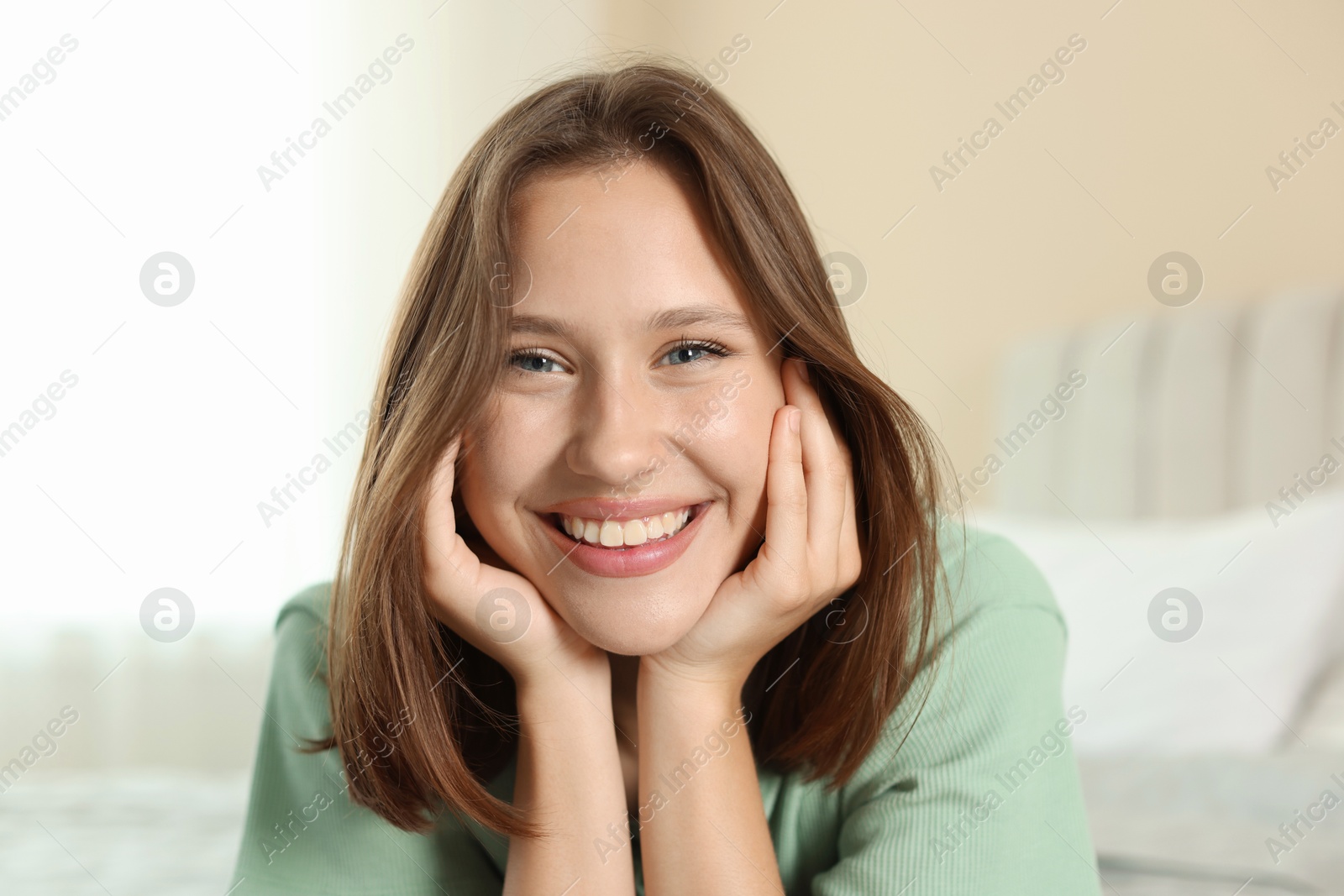 Portrait of smiling teenage girl at home Photo of Portrait of smiling teenage girl at home