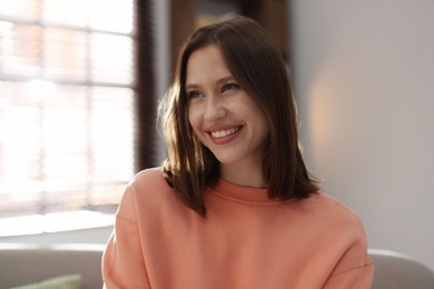 Photo of Portrait of smiling teenage girl at home