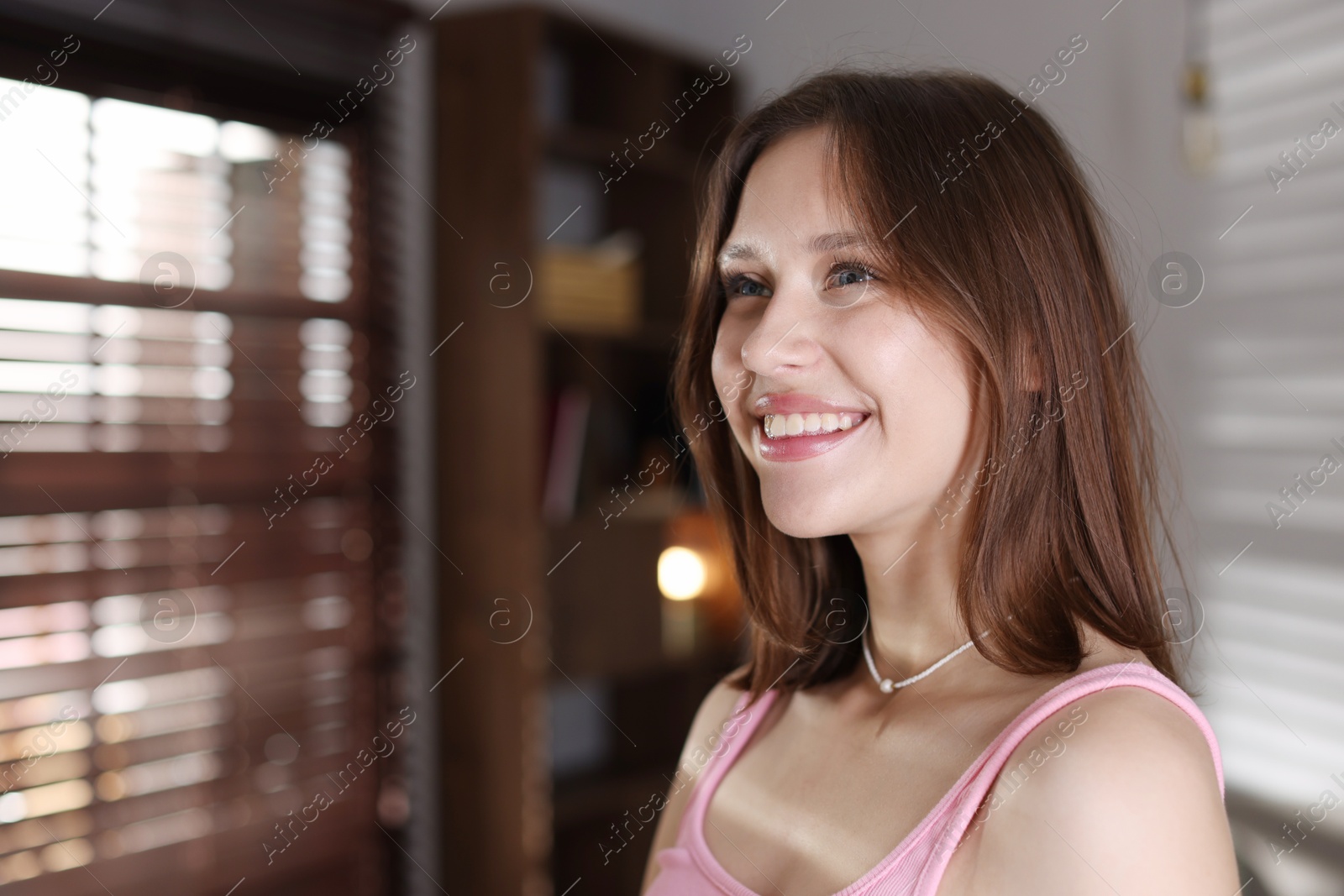 Smiling teenage girl at home. Space for text Photo of Smiling teenage girl at home. Space for text