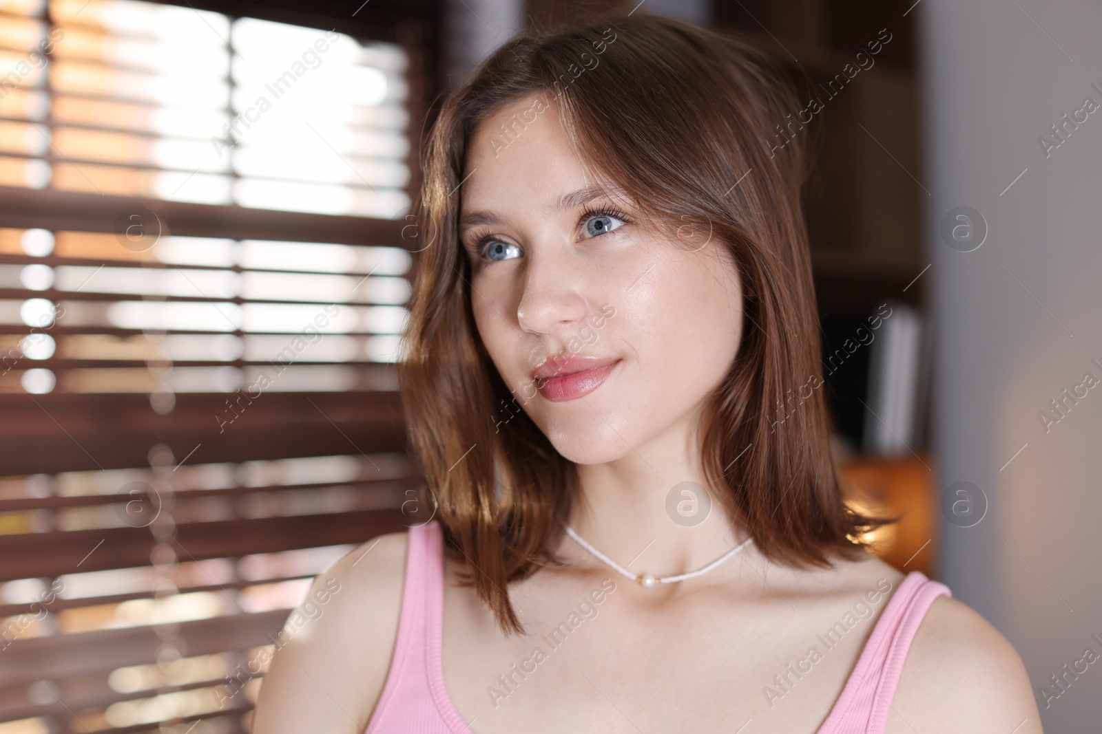 Portrait of beautiful teenage girl at home Photo of Portrait of beautiful teenage girl at home