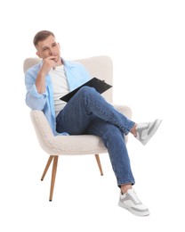 Photo of Thoughtful psychologist with clipboard sitting on armchair against white background
