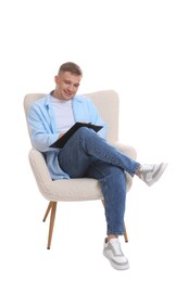Photo of Smiling psychologist with clipboard sitting on armchair against white background