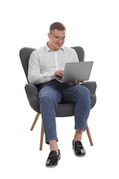 Photo of Smiling psychologist in glasses during online session by laptop sitting on armchair against white background