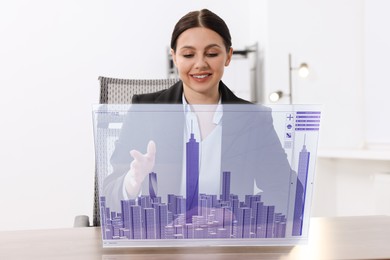 Image of Building information modelling. Woman using virtual screen in office