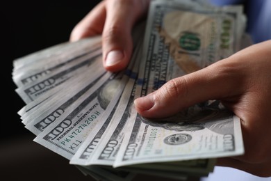 Photo of Woman counting her money indoors, closeup view