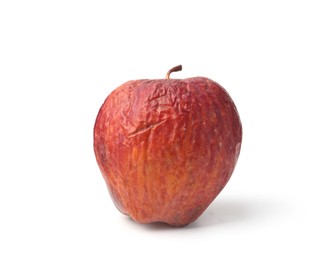 Photo of One rotten apple with wrinkles isolated on white