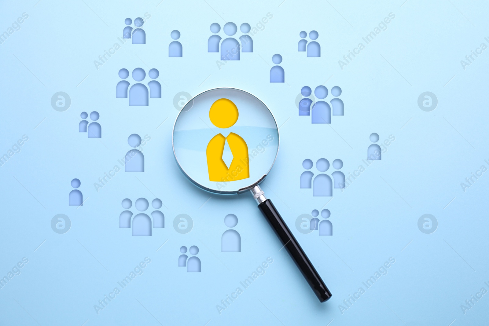 Targeting. Magnifying glass and human icons against light blue background, top view Image of Targeting. Magnifying glass and human icons against light blue background, top view