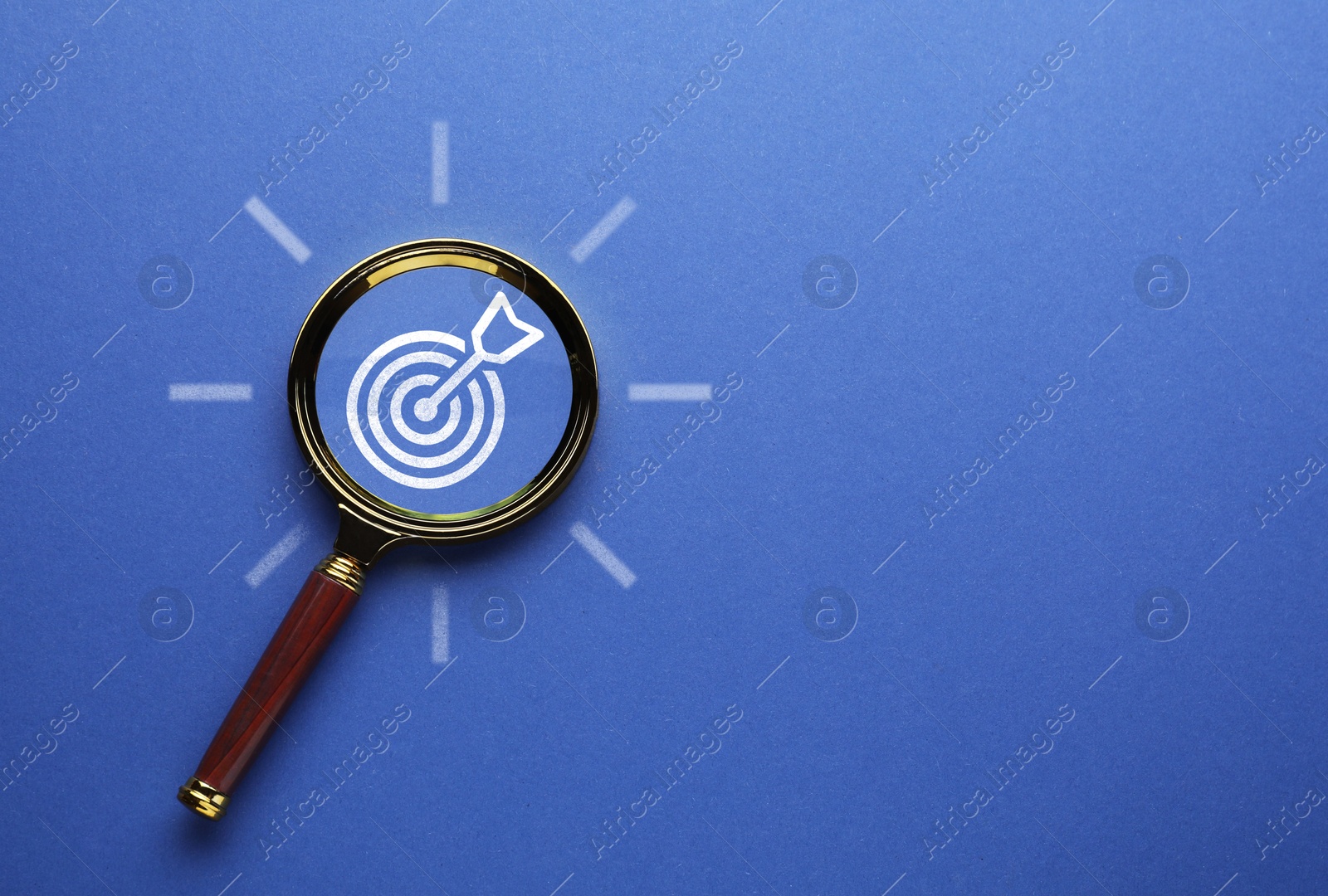 Targeting. Magnifying glass with bullseye on blue background, top view Image of Targeting. Magnifying glass with bullseye on blue background, top view