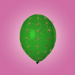 Image of Green balloon covered with cactus prickles on pink gradient background