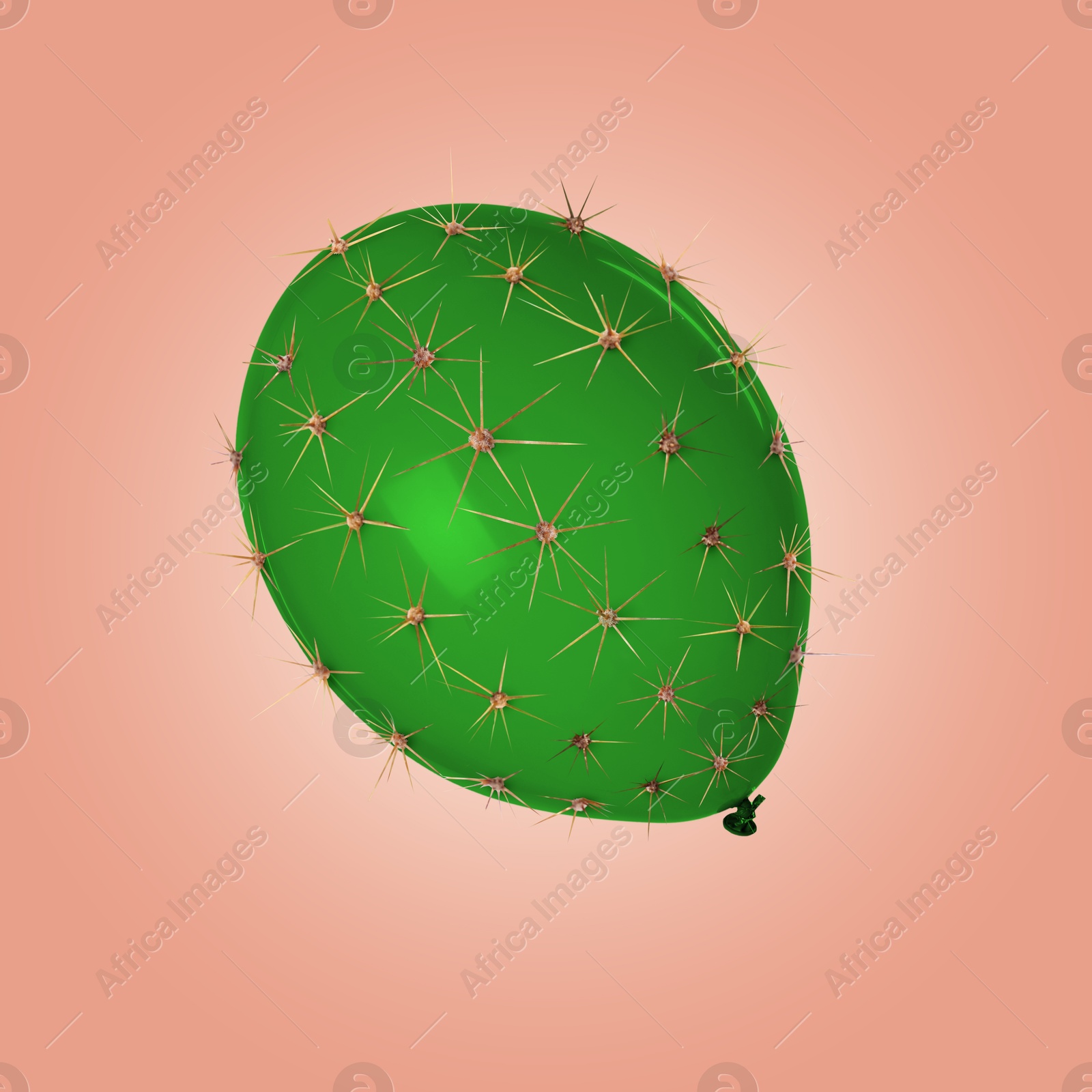 Image of Green balloon covered with cactus prickles on coral gradient background