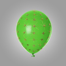 Image of Green balloon covered with cactus prickles on grey background