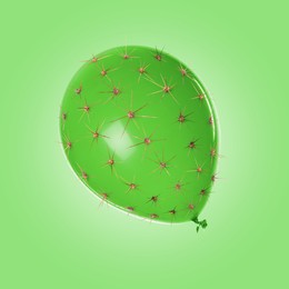 Image of Balloon covered with cactus prickles on light green background