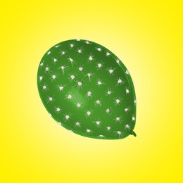 Image of Green balloon covered with cactus prickles on yellow gradient background