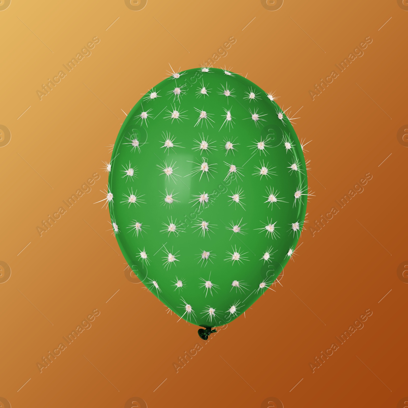 Image of Green balloon covered with cactus prickles on brown gradient background