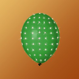 Image of Green balloon covered with cactus prickles on brown gradient background