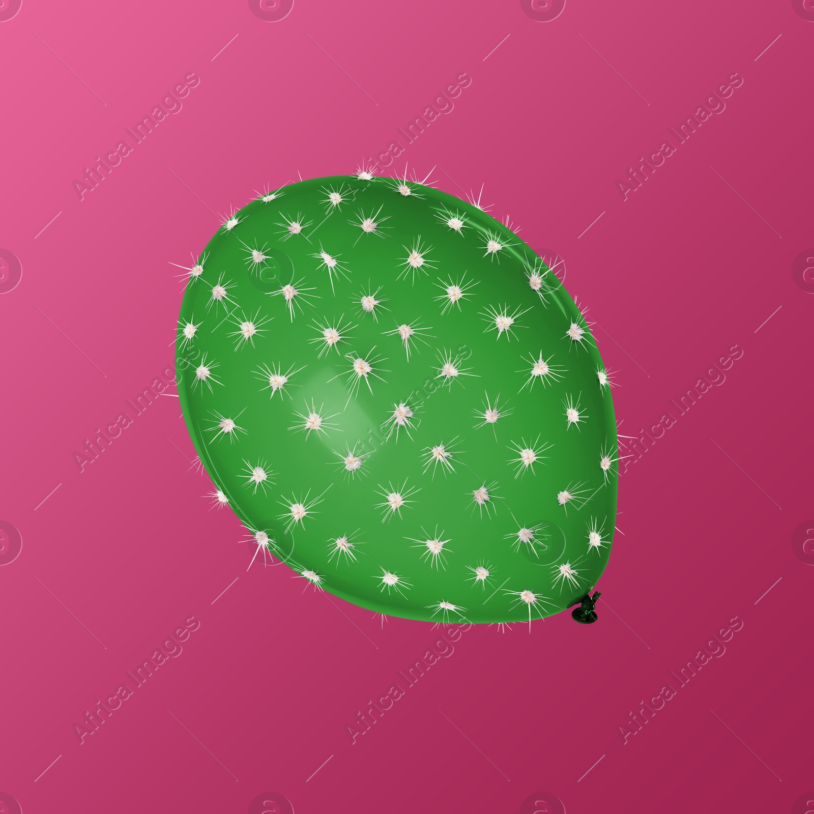 Image of Green balloon covered with cactus prickles on crimson gradient background