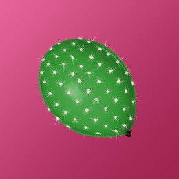 Image of Green balloon covered with cactus prickles on crimson gradient background