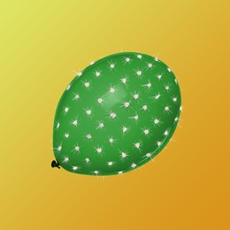 Image of Green balloon covered with cactus prickles on golden gradient background