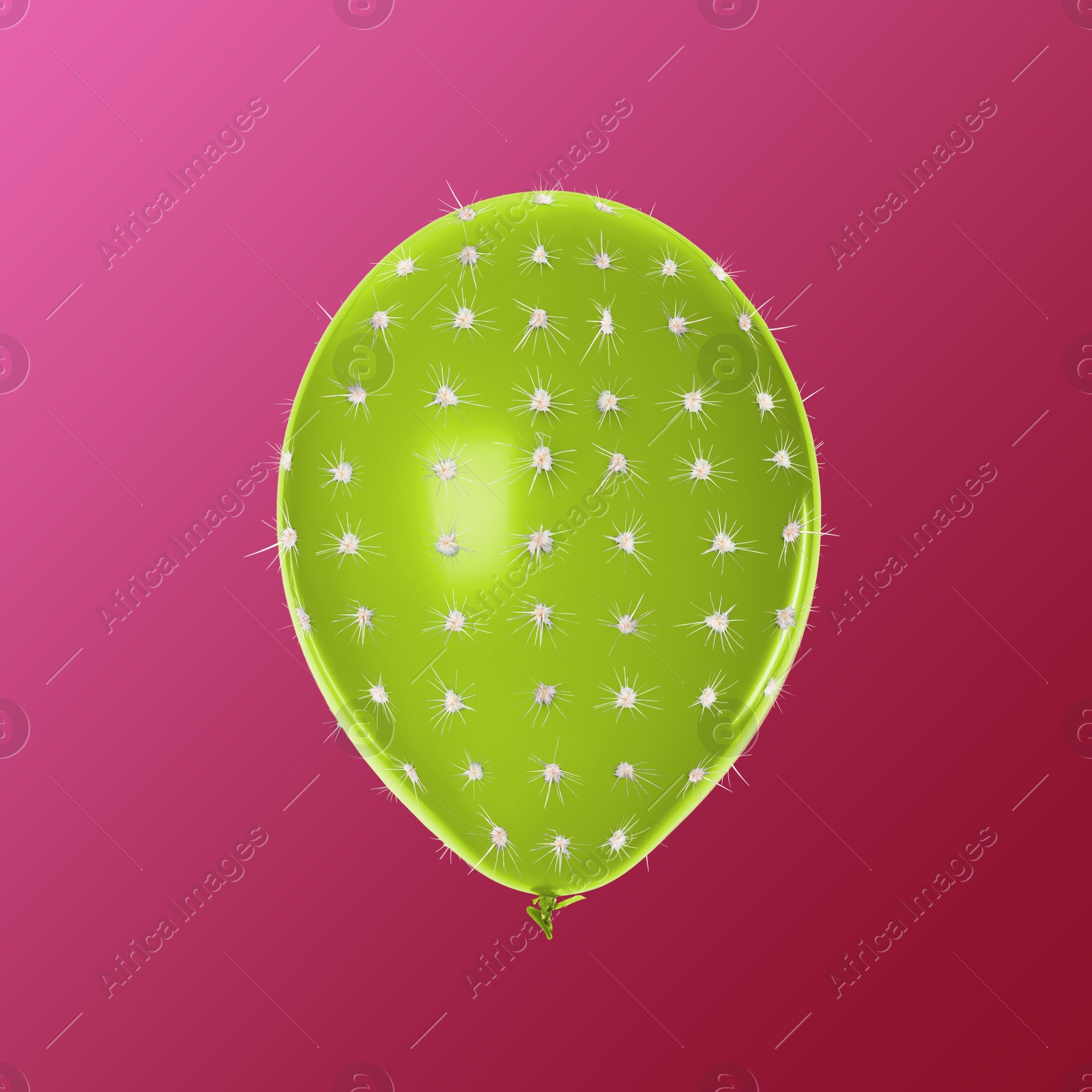 Image of Green balloon covered with cactus prickles on crimson gradient background