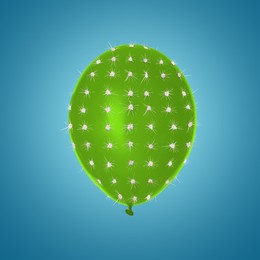 Image of Green balloon covered with cactus prickles on blue gradient background