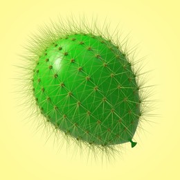 Image of Green balloon covered with cactus prickles on pale yellow background