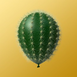 Image of Green balloon covered with cactus prickles on golden gradient background