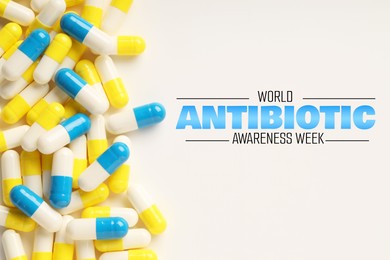 Image of World antibiotic awareness week. Many pills on white background, flat lay