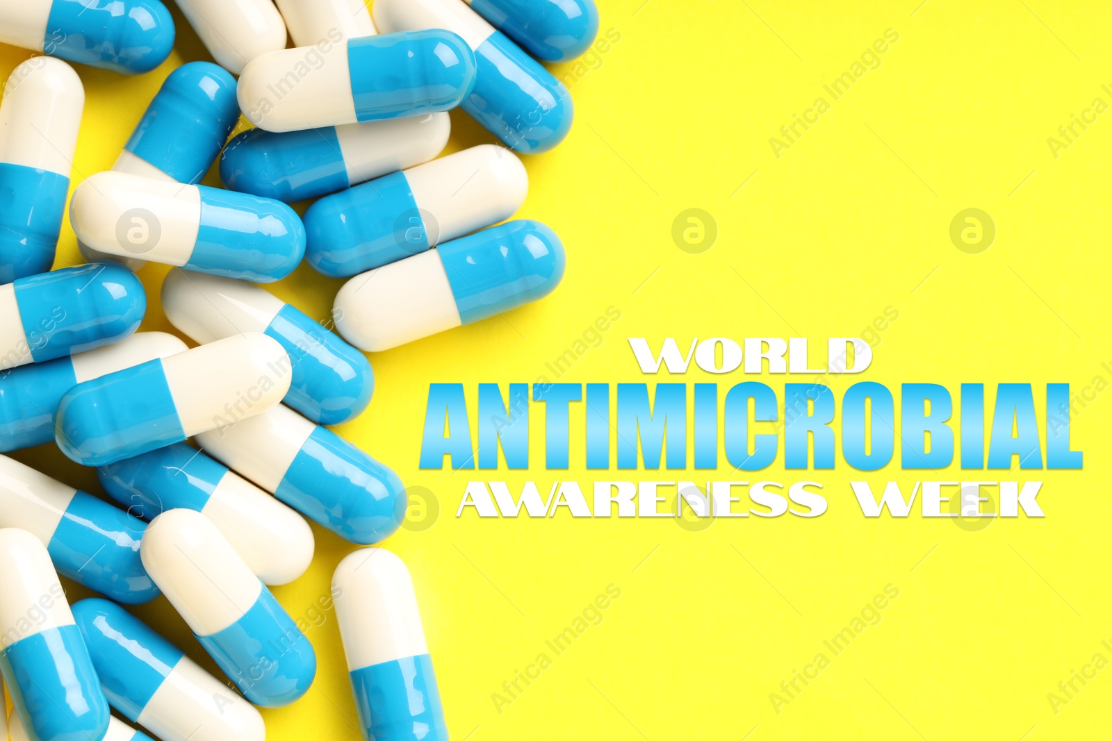 World antibiotic awareness week. Many pills on yellow background, flat lay Image of World antibiotic awareness week. Many pills on yellow background, flat lay